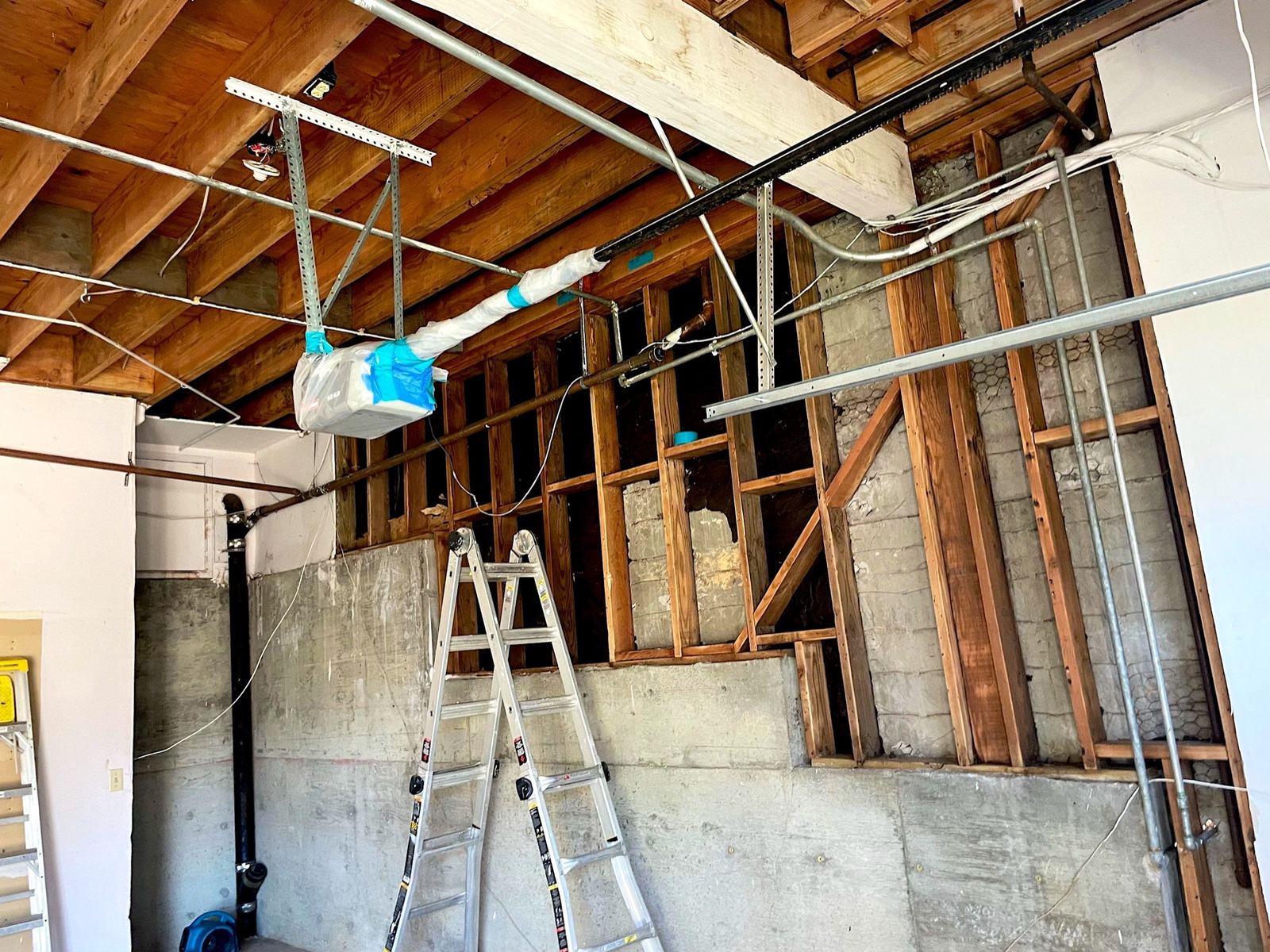Opened kitchen wall and ceiling during water damage cleanup