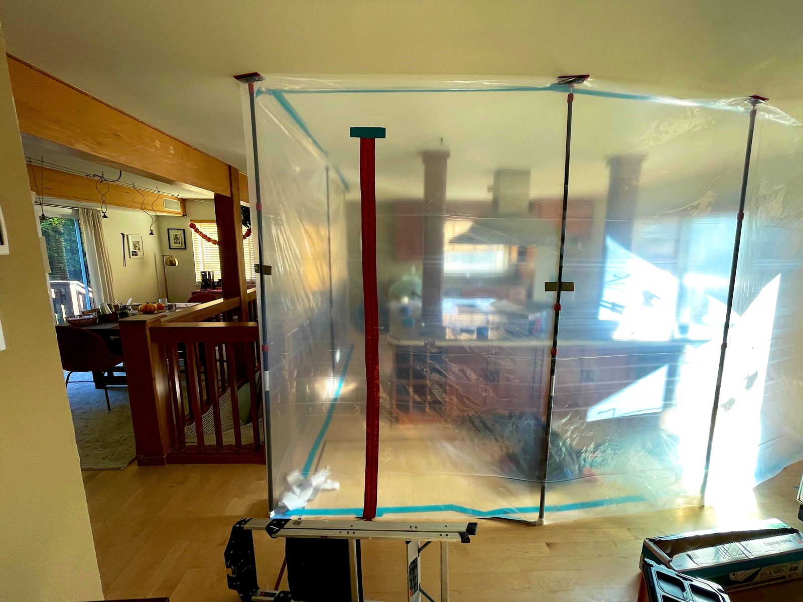 Zippered containment partition separating the kitchen work area