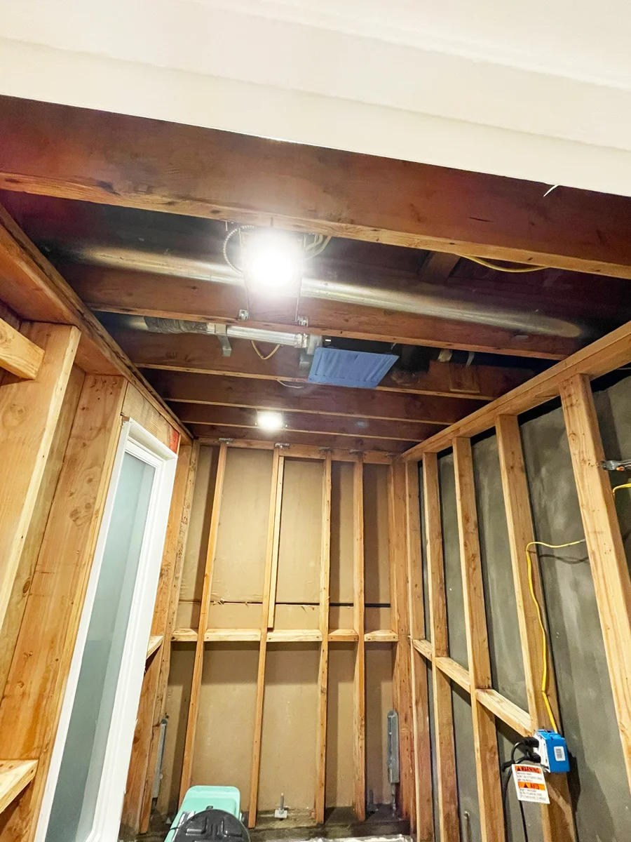 Exposed wall and ceiling framing after damaged drywall removal — San Francisco, CA