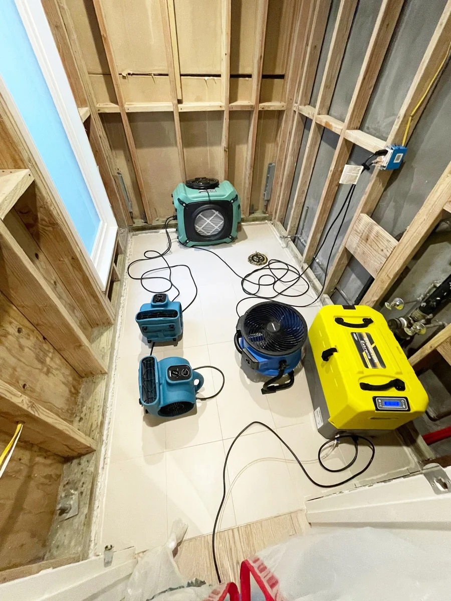 Air movers and a dehumidifier drying exposed wall framing — San Francisco, CA