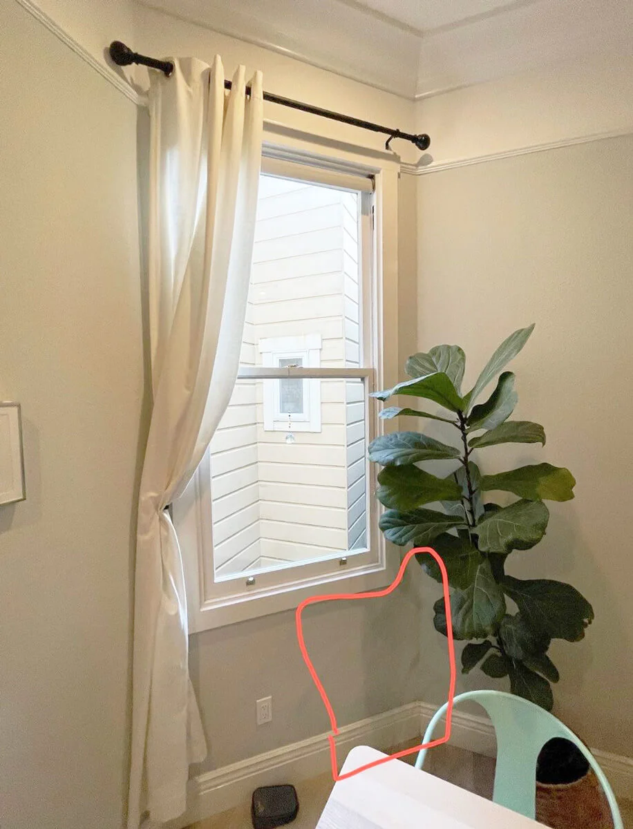 Marked wall damage below a dining-room window — San Francisco, CA