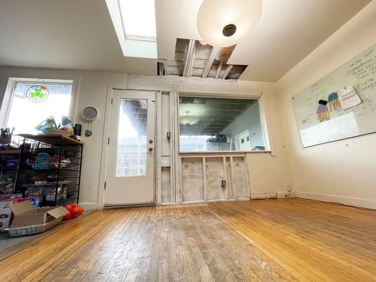Coated wall framing below a window during remediation — Pacifica, CA