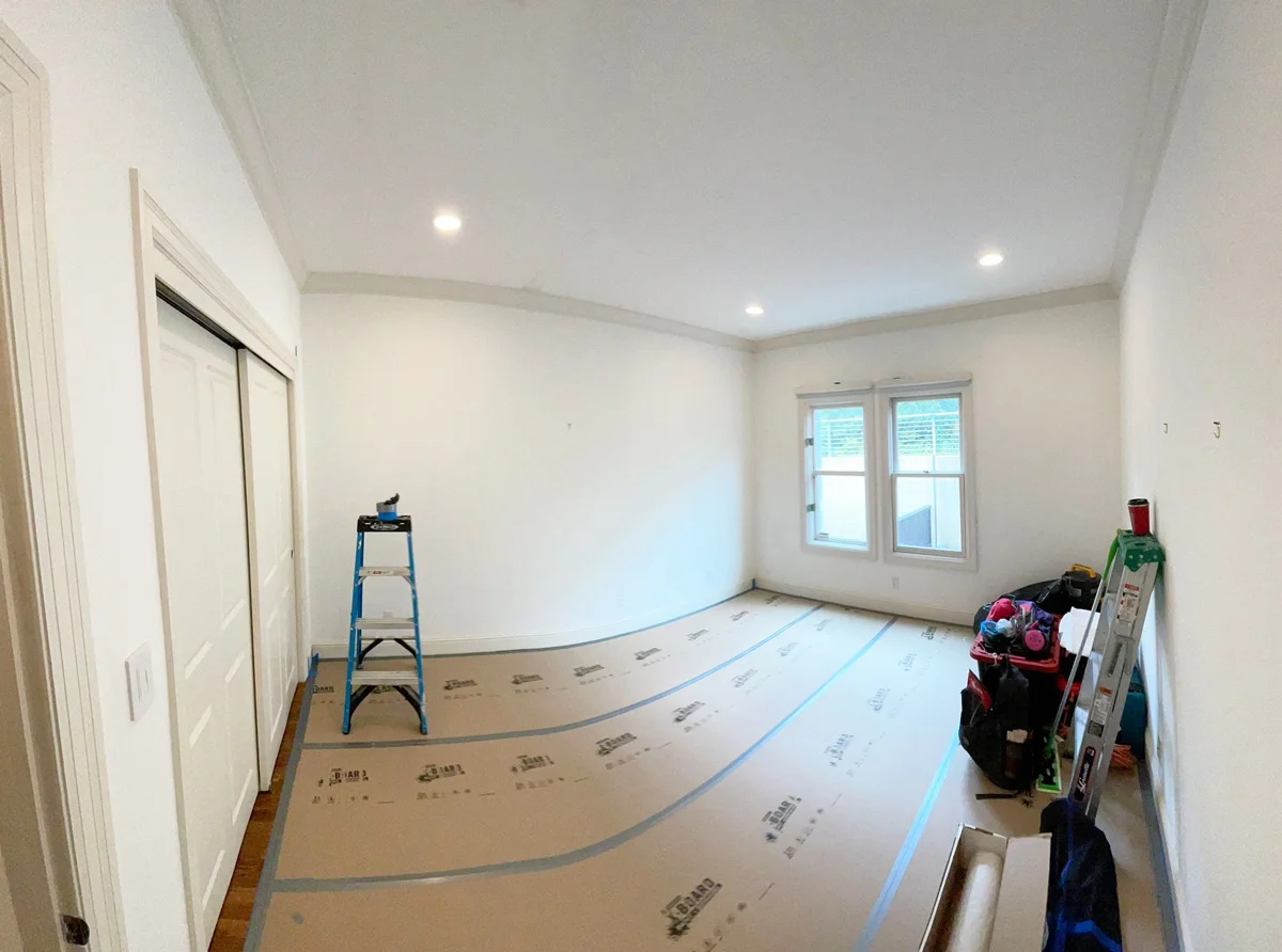 Bedroom floor covered with protective paper before restoration — San Francisco, CA