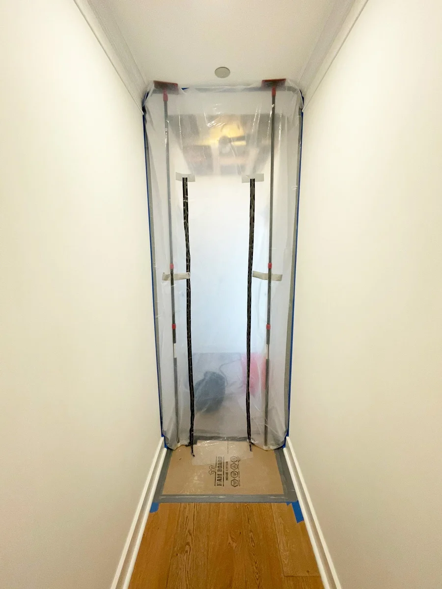 Zippered plastic containment in a narrow hallway — San Francisco, CA