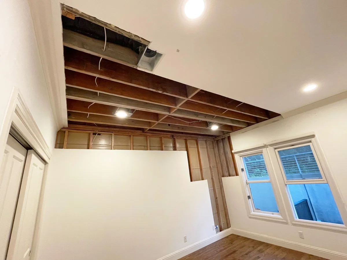 Opened wall and ceiling framing after remediation — San Francisco, CA