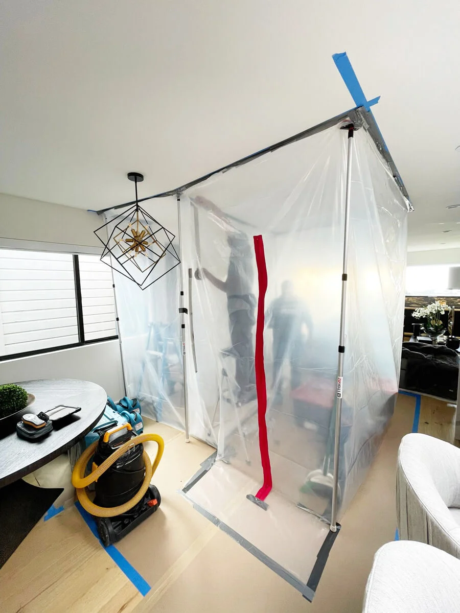 Zippered decontamination enclosure beside a dining area — San Francisco, CA