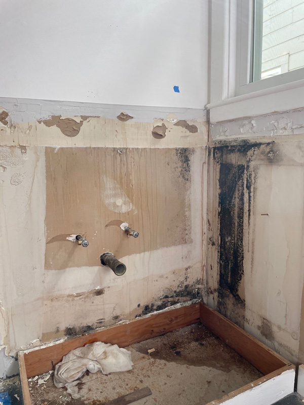 Dark staining exposed behind a removed bathroom fixture — San Francisco, CA