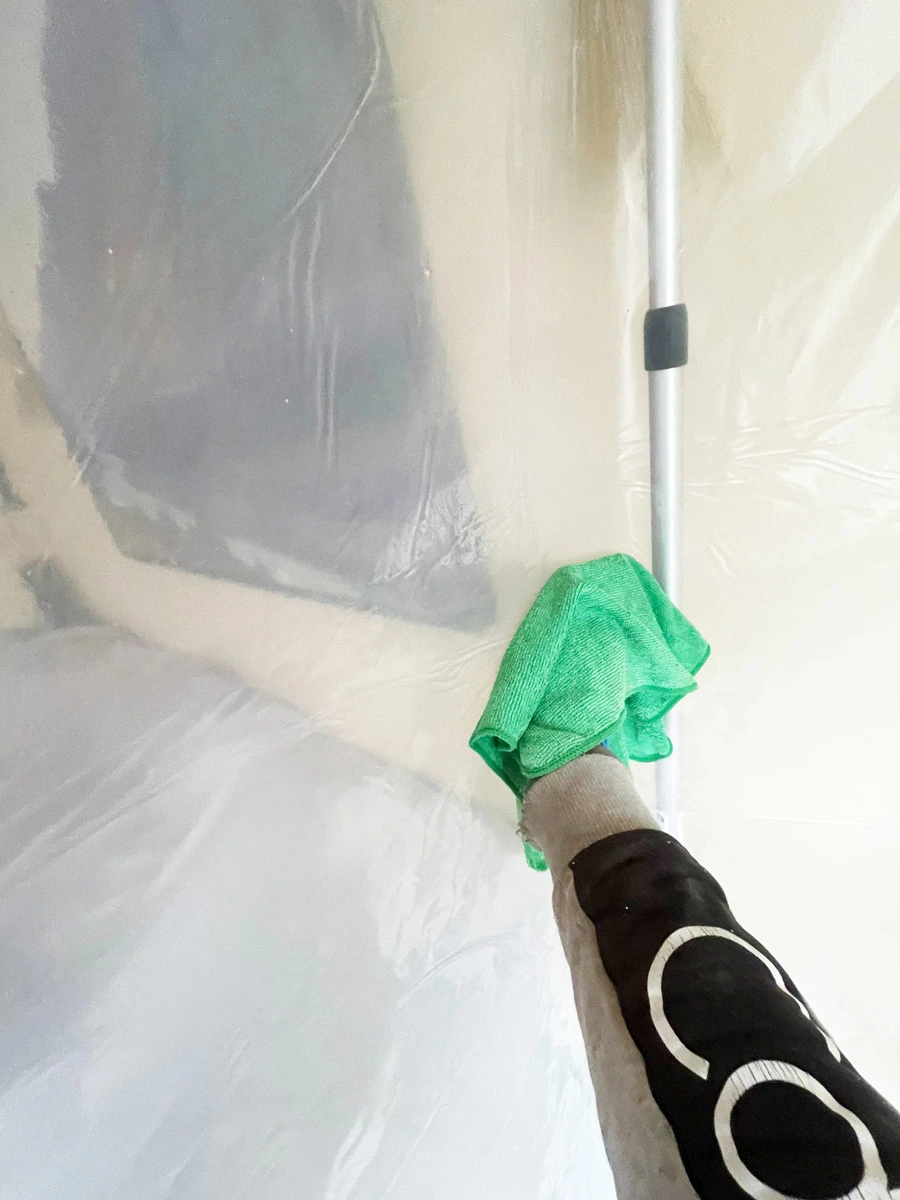 Gloved hand cleaning containment sheeting — San Francisco, CA