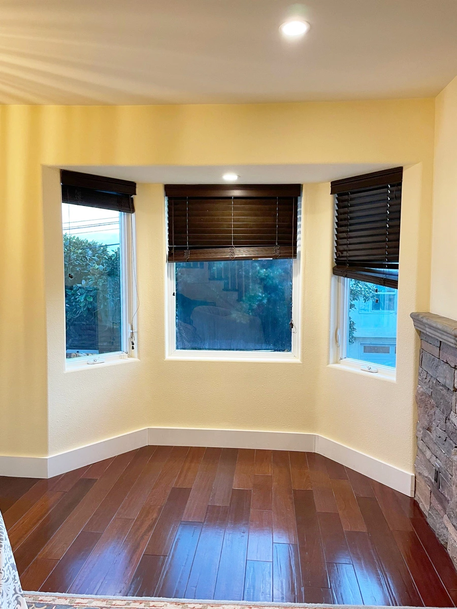 Restored bay-window alcove with wood flooring and window blinds — San Francisco, CA