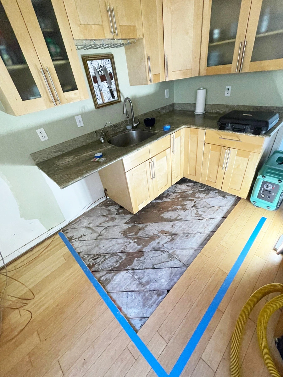 Removed section of kitchen flooring outlined with tape — San Francisco, CA