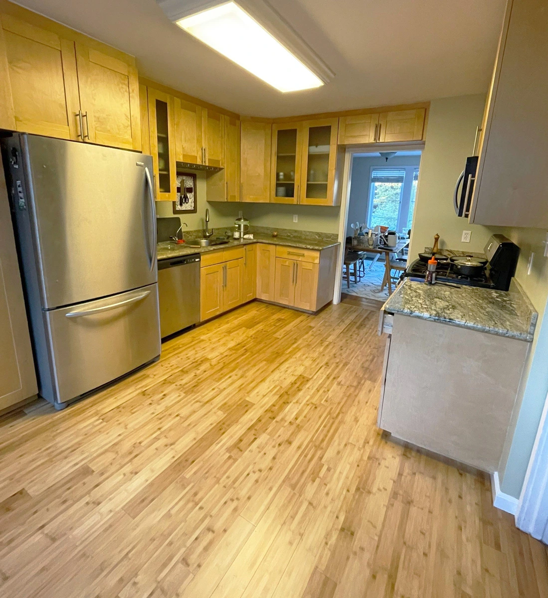 Kitchen with finished replacement wood flooring — San Francisco, CA