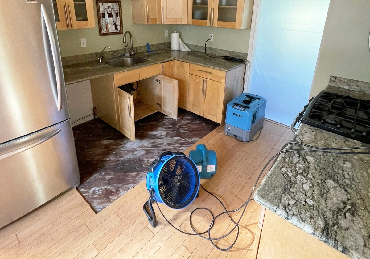 Air movers drying a kitchen after water damage — San Francisco, CA